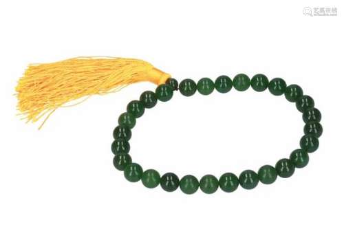 A necklace with jade beads. China, 20th century.