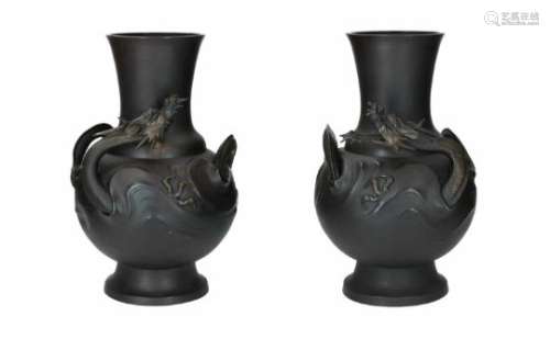 A pair of bronze vases with relief decor of dragons. Unmarked. Japan, Meiji. Total weight approx.