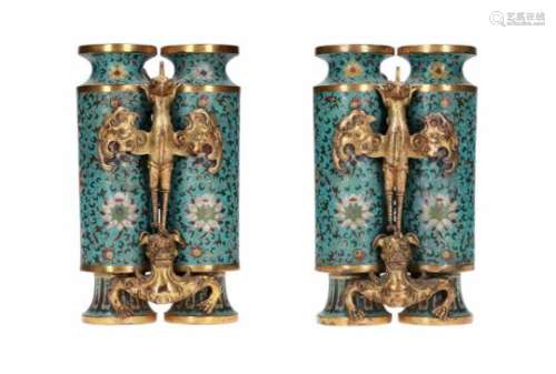 A pair of rare gilt-bronze and enamel cloisonné 'champion' vases. The tall cylindrical vessel joined