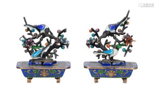 A pair of silver and cloissoné sculptures of jardinières with flowers and birds. China, ca. 1950.