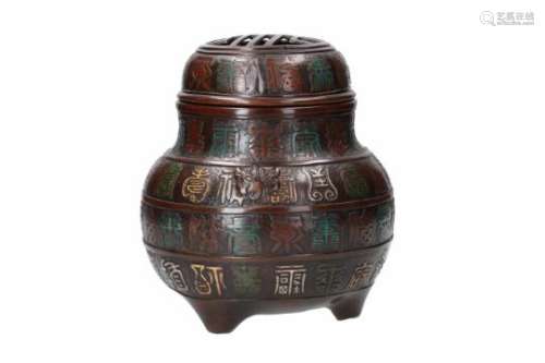 A tripod polychrome cloisonné incense burner, decorated with characters and masks. Unmarked.