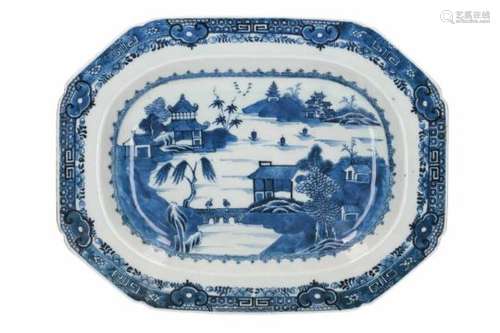 A rectangular blue and white porcelain serving dish, decorated with figures and buildings in a river