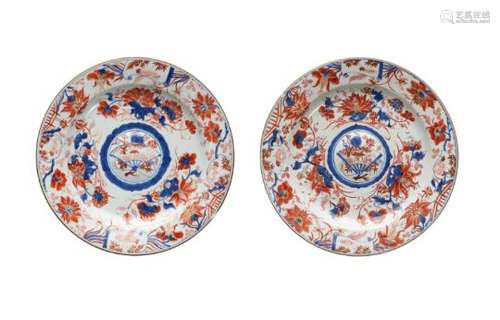 A pair of Imari porcelain chargers, decorated with flowers and a fan. Unmarked. China, 18th