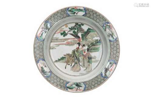 A famille verte porcelain deep charger, decorated with long Elizas, landscapes and flowers.