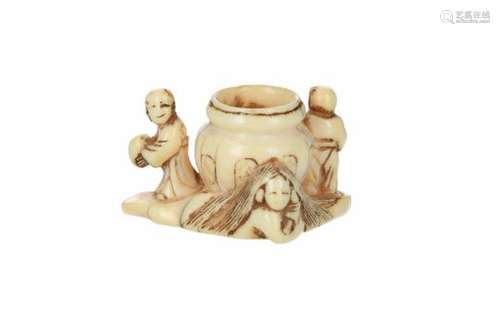 An ivory netsuke of three karako around a jar. Japan, first half of the 19th century. L. 4 cm.