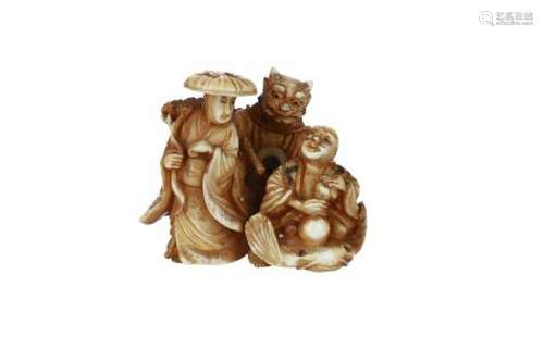 An ivory netsuke of three figures with attributes. Signed Shinya. Japan, 19th century. H. 3 cm.