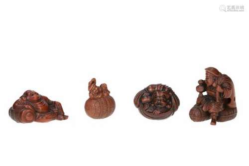 Lot of four netsuke, 1) boxwood, Daikoku with hammer and bag, leaning on rice bale. L. 5 cm. 2)