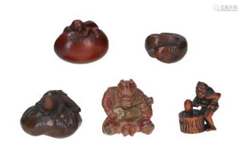 Lot of five netsuke, 1) softwood, Oni sitting cross-legged. H. 4.5 cm. 2) wood, two fish. L. 3.5 cm.