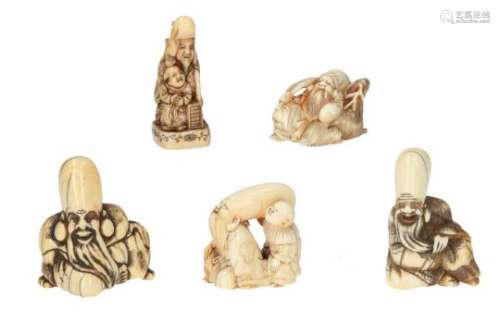 Lot of five netsuke, 1) ivory, Jurojin with fan, leaning on a deer. H. 2.5 cm. 2) ivory, sitting