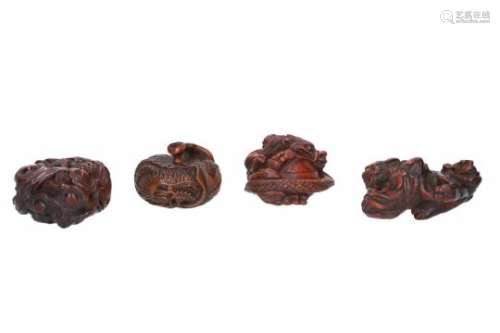 Lot of four netsuke, 1) wood, curled up dragon with clouds and flames. H. 3.5 cm. 2) wood, curled up