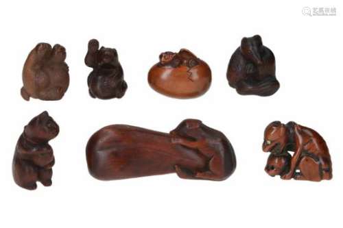 Lot of seven netsuke, 1) wood, Tanuki drumming on belly. Signed Minko and Kao. H. 3.5 cm. 2) wood,