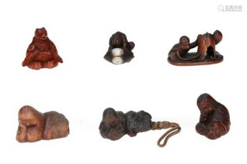 Lot of six netsuke, 1) wood, Tanuki sitting cross-legged in monk's robe. Signed Kunimitsu. H. 3