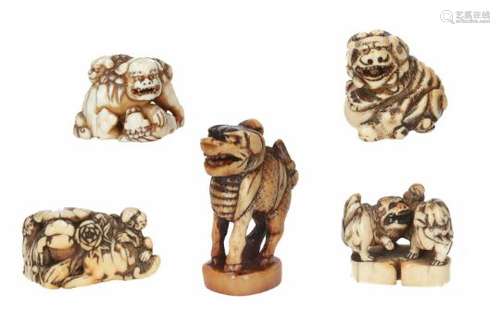 Lot of five netsuke, 1) ivory, shishi with ball. H. 3.5 cm. 2) ivory, two shishi with cub. Signed.