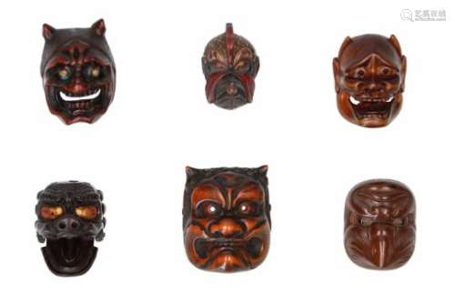 Lot of six netsuke, 1) wood, Oni mask with metal eyes. Signed Tanzan. H. 5 cm. 2) wood, Tengu/Ikkaku