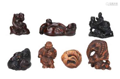 Lot of seven netsuke, 1) wood, two karako playing with Hotei's bag. L. 6.5 cm. 2) wood, standing