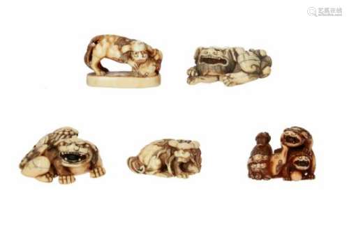 Lot of five netsuke, 1) ivory, shishi with cub on base. Signed Gyosai. L. 4.5 cm. 2) ivory, shishi