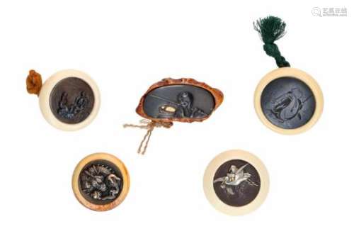 Lot of five manju, 1) ivory, silver and iron, Jurojin with scroll on flying stork. Diam. 4 cm. 2)