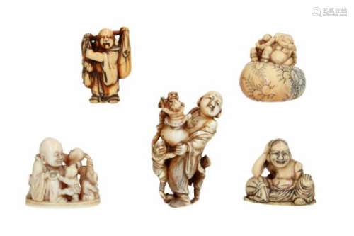 Lot of five netsuke, 1) ivor, Hotei with four Oni. Signed. H. 6 cm. 2) ivory, sitting Hotei. H. 3