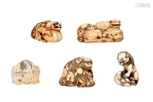 Lot of five netsuke, 1) ivory, shishi with ball. H. 2.5 cm. 2) ivory, shishi with cub. L. 6 cm. 3)