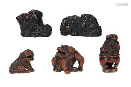 Lot of five netsuke, 1) umimatsu coral, shishi on rock with peony. H. 4 cm. 2) wood and ivory,