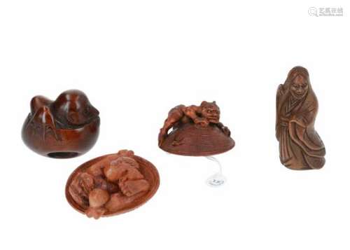 Lot of four netsuke, 1) wooden Tengu hatching from egg. H. 4 cm. 2) wooden Oni hiding under hat.