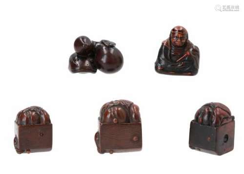 Lot of five netsuke, 1) wooden Oni in box. Signed Masajo. H. 2 cm. 2) wood with lacquer, sitting