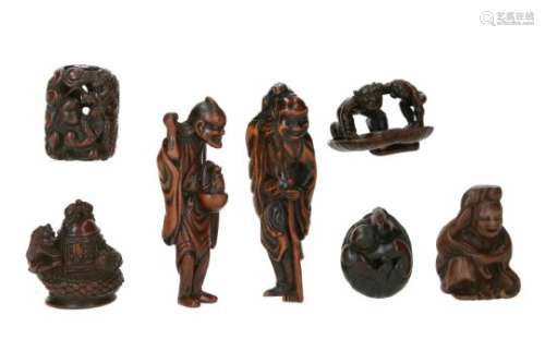 Lot of seven netsuke, 1) wood and ivory, Kiyohime curled around a moving temple bell. Signed