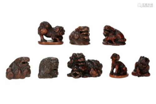 Lot of eight netsuke, 1) boxwood, sitting karako with shishi mask. H. 3.5 cm. 2) wood, shishi with