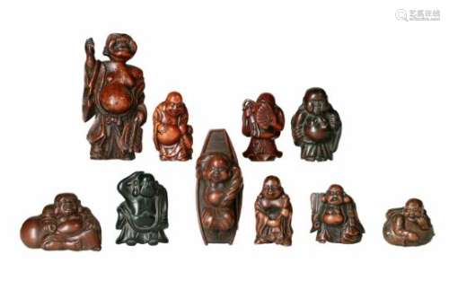 Lot of ten netsuke, 1) wood, standing Hotei with bag. H. 4.5 cm. 2) boxwood, lying Hotei in a