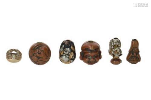 Lot of six ojime, 1) copper, Hotei with bag. Signed. H. 1.5 cm. 2) gilded silver, mokugyo temple