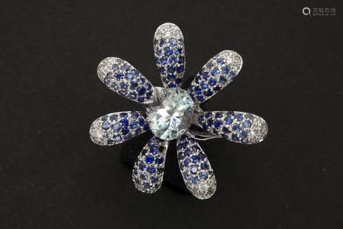 ring in white gold (18 carat) with an ca 3,50 carat topaz, ca 1,50 carat of sapphires [...]