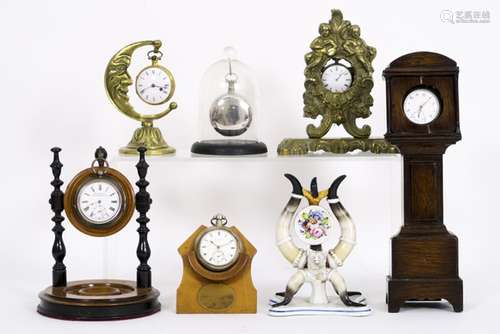 collection of 7 old and antique watch stand each with its pocket watch - - [...]