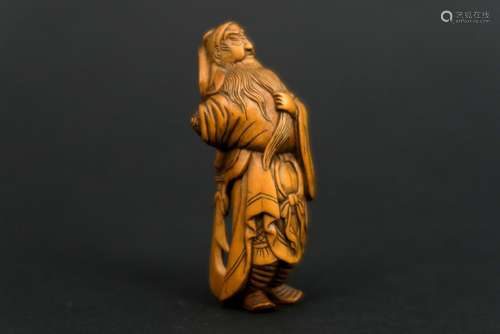 antique late Edo period finely cut wooden netsuke with the representation of 