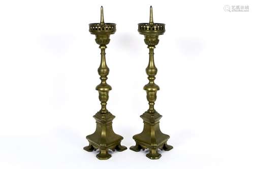 pair of quite big 17th/18th Cent. church candlesticks with triangular base in bronze [...]