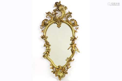 mirror with an antique, guilded Louis XV style frame with cupids - - Spiegel met [...]