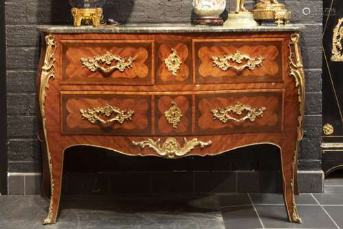 Louis XV chest of drawers in marquetry with mountings in bronze and marble top - - [...]