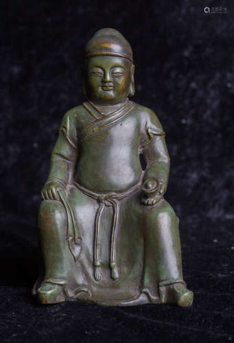 Copper statue of seated buddha