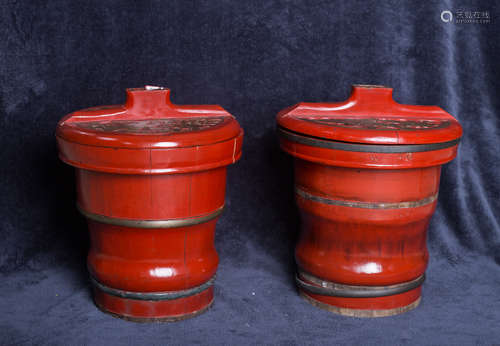 A pair of red Chinese ancient wood barrels with covers