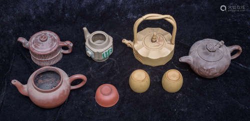 8 zi sha pottery teapots. one is marked by Gu Jing zhou