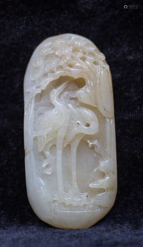 A jade carving of crane and pine tree