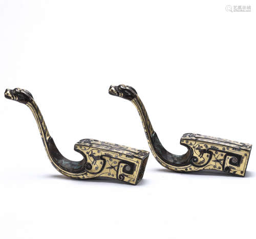 the Period of The Warring Han Dynasty, A pair of bronze screw gold and silver animal shape pendant
