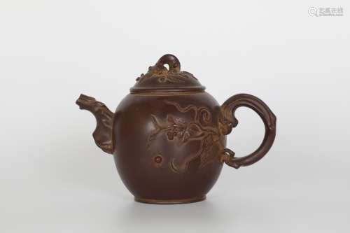 Dark-red enameled pottery teapot