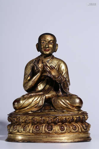 GILT BRONZE CAST AND CARVED 'GURU' SEATED FIGURE