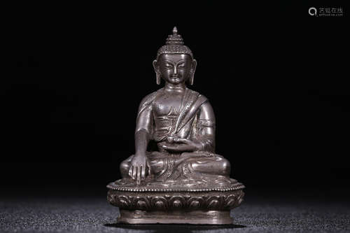 SILVER CAST AND CARVED 'SHAKYAMUNI' SEATED FIGURE