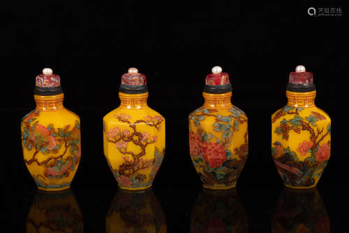 FOUR YELLOW GLASS SNUFF BOTTLES