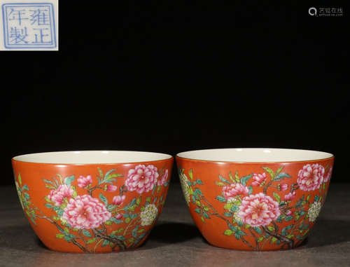 PAIR OF FAMILLE ROSE RED GROUND 'FLOWERS' CUPS