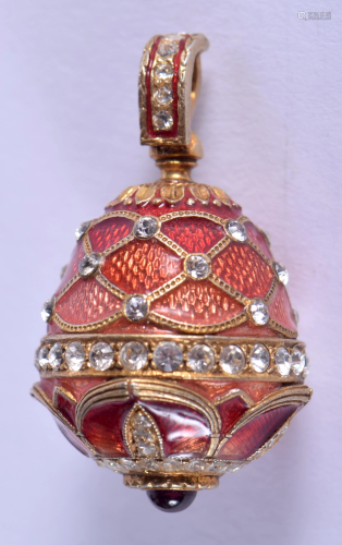 A CONTINENTAL SILVER AND ENAMEL EGG PENDANT…