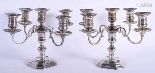 A PAIR OF TIFFANY AND CO SILVER CANDLESTICKS.