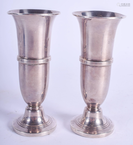 A PAIR OF VINTAGE SILVER VASES. 179 grams we…