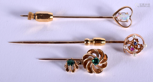 THREE VINTAGE GOLD STICK PINS. 6.9 grams. (3)